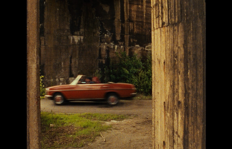 The German Chain Saw Massacre: Schlingensief’s claustrophobic staging of the abandoned industrial site/  Cars do not promise escape – but they are entrapped within bordered frames